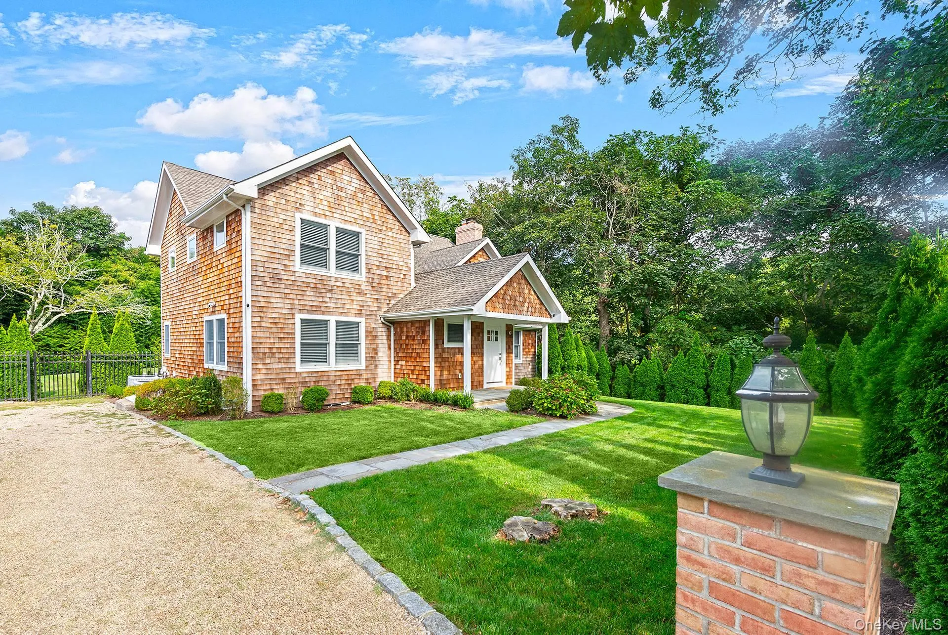 View of front of home featuring a front lawn, roof with shingles, and a chimney View of front of home featuring a front lawn, roof with shingles, and a chimney
