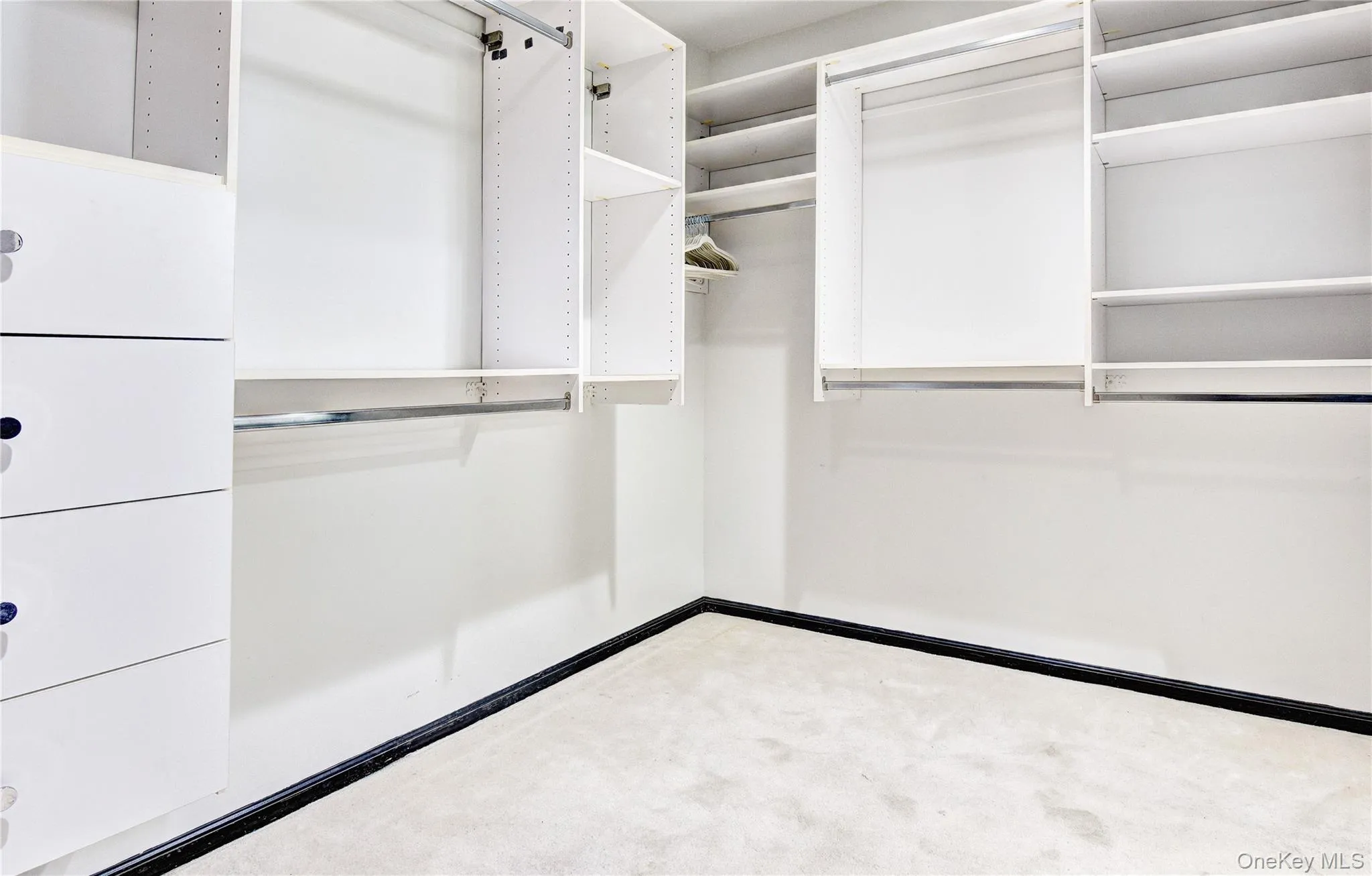 Primary Bedroom walk-in closet Primary Bedroom walk-in closet