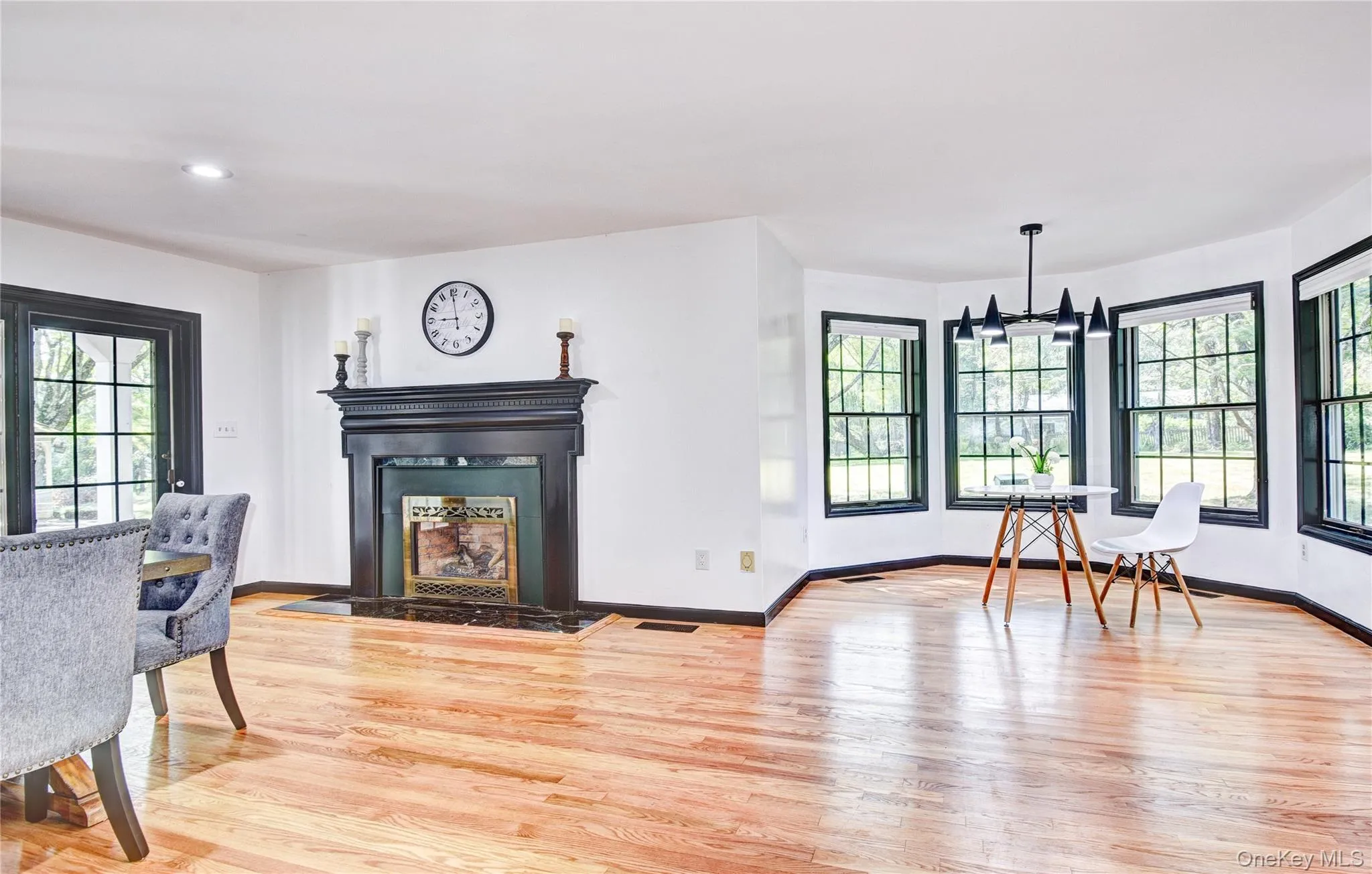 Open Floor Plan Dining Area featuring a Fireplace Open Floor Plan Dining Area featuring a Fireplace