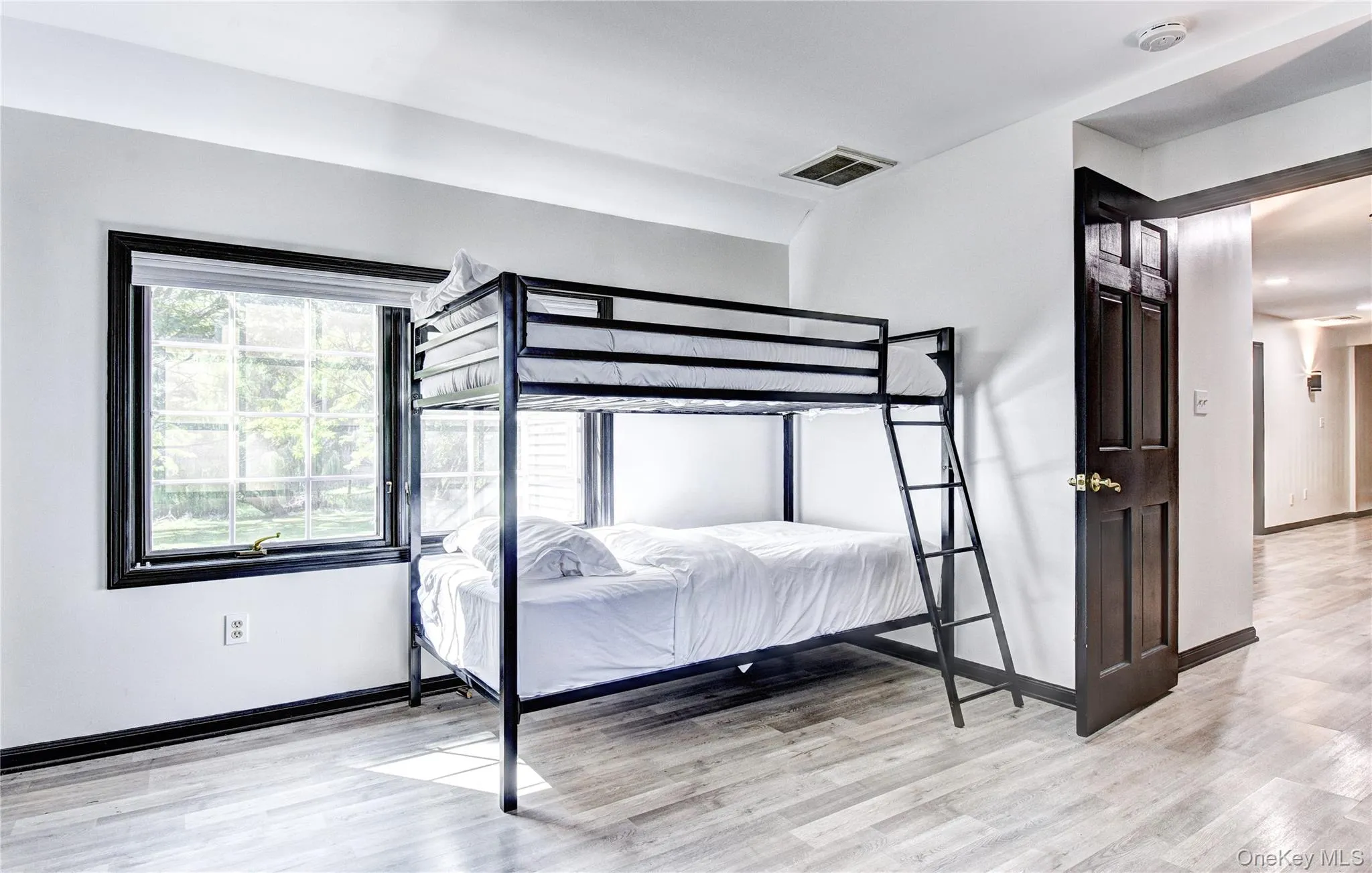 Bedroom with luxury vinyl flooring and its own bathroom Bedroom with luxury vinyl flooring and its own bathroom