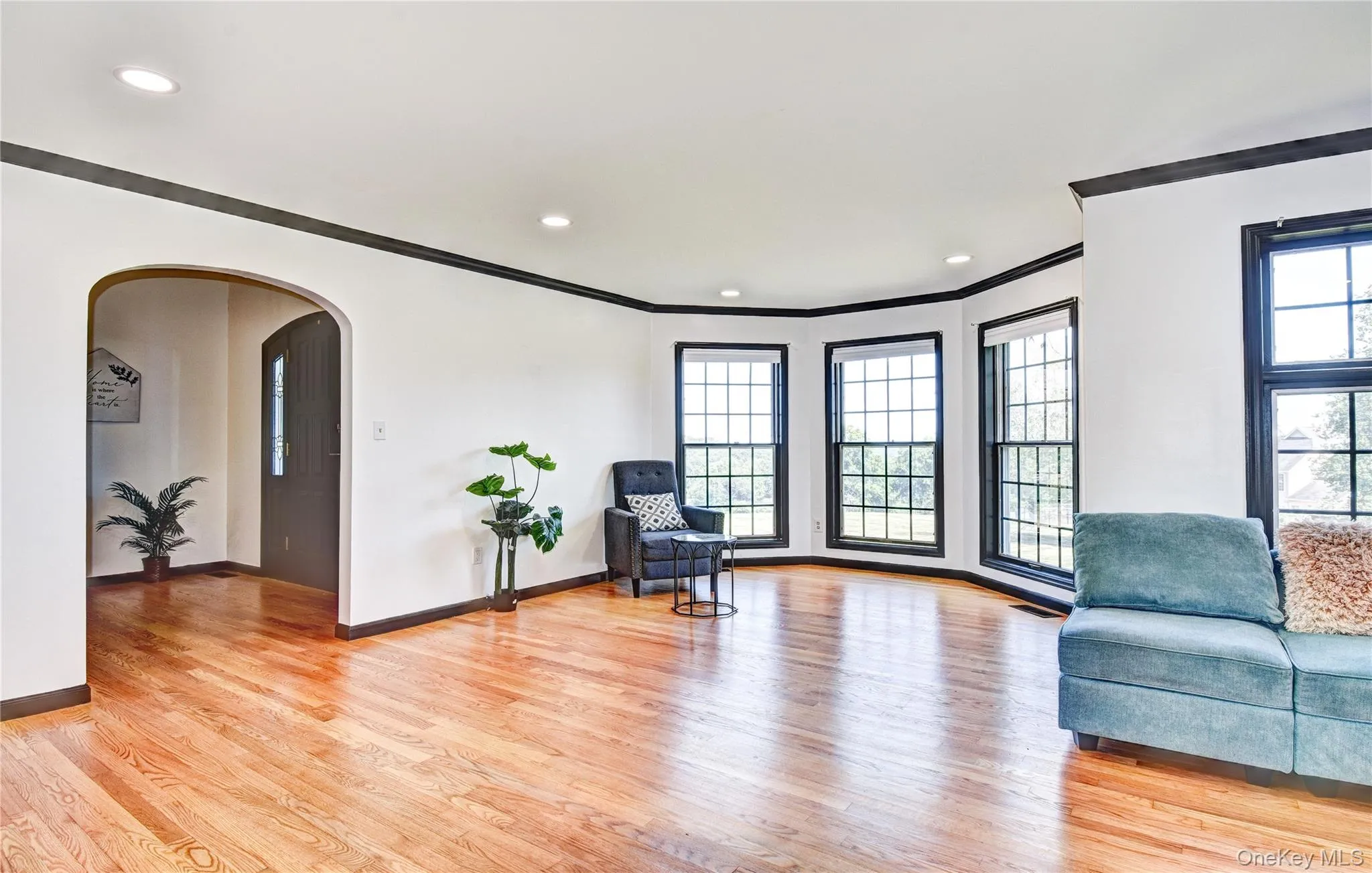 Living area with arched hallways Living area with arched hallways