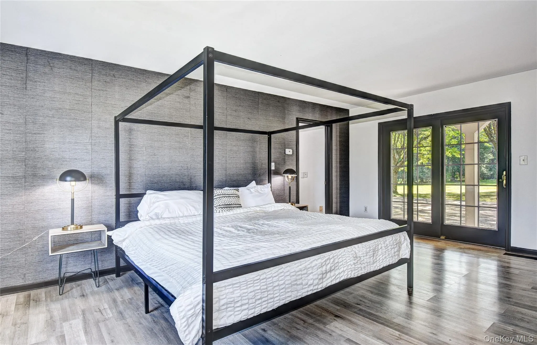 French doors leading to your backyard from the primary bedroom. Enjoy your coffee outside your bedroom! French doors leading to your backyard from the primary bedroom. Enjoy your coffee outside your bedroom!