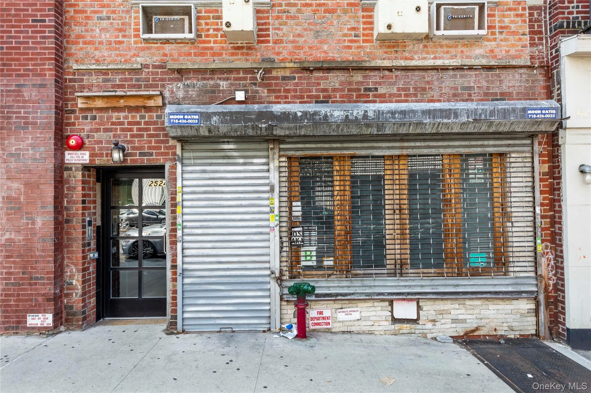 Doorway to property with brick siding and a patio area Doorway to property with brick siding and a patio area