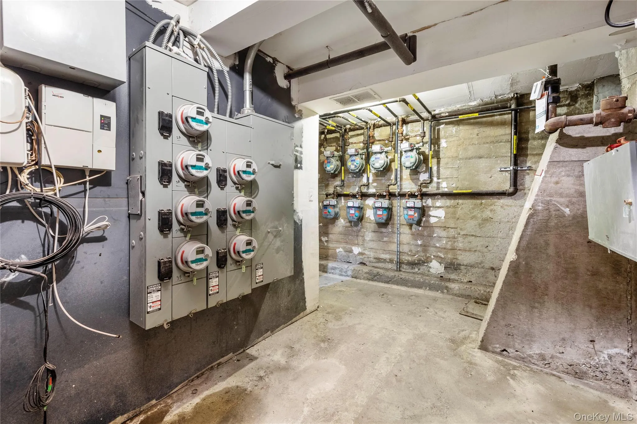 Utility room with gas meter and electric meter Utility room with gas meter and electric meter