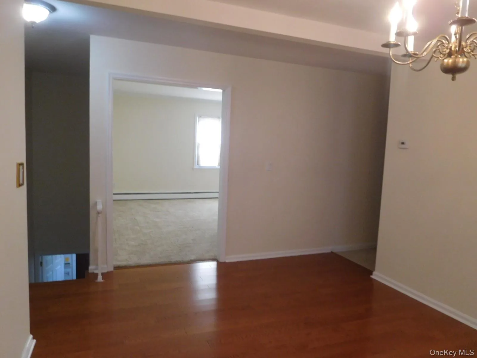 View of Formal Dining Room into Living Room View of Formal Dining Room into Living Room