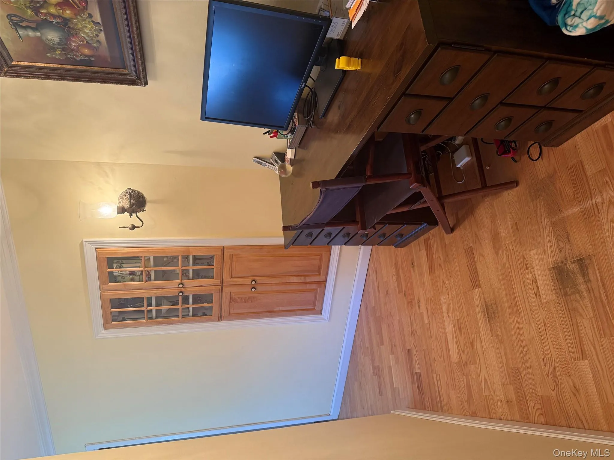 Office area featuring light wood-type flooring and crown molding Office area featuring light wood-type flooring and crown molding