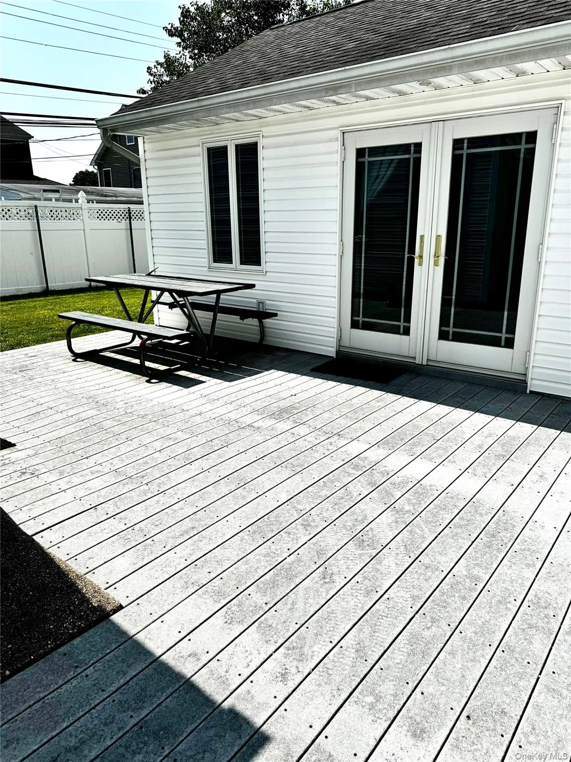 Wooden deck featuring french doors Wooden deck featuring french doors