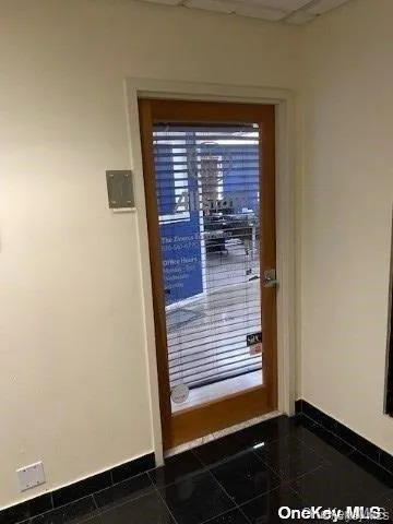 Entryway featuring baseboards and granite tiled floors Entryway featuring baseboards and granite tiled floors