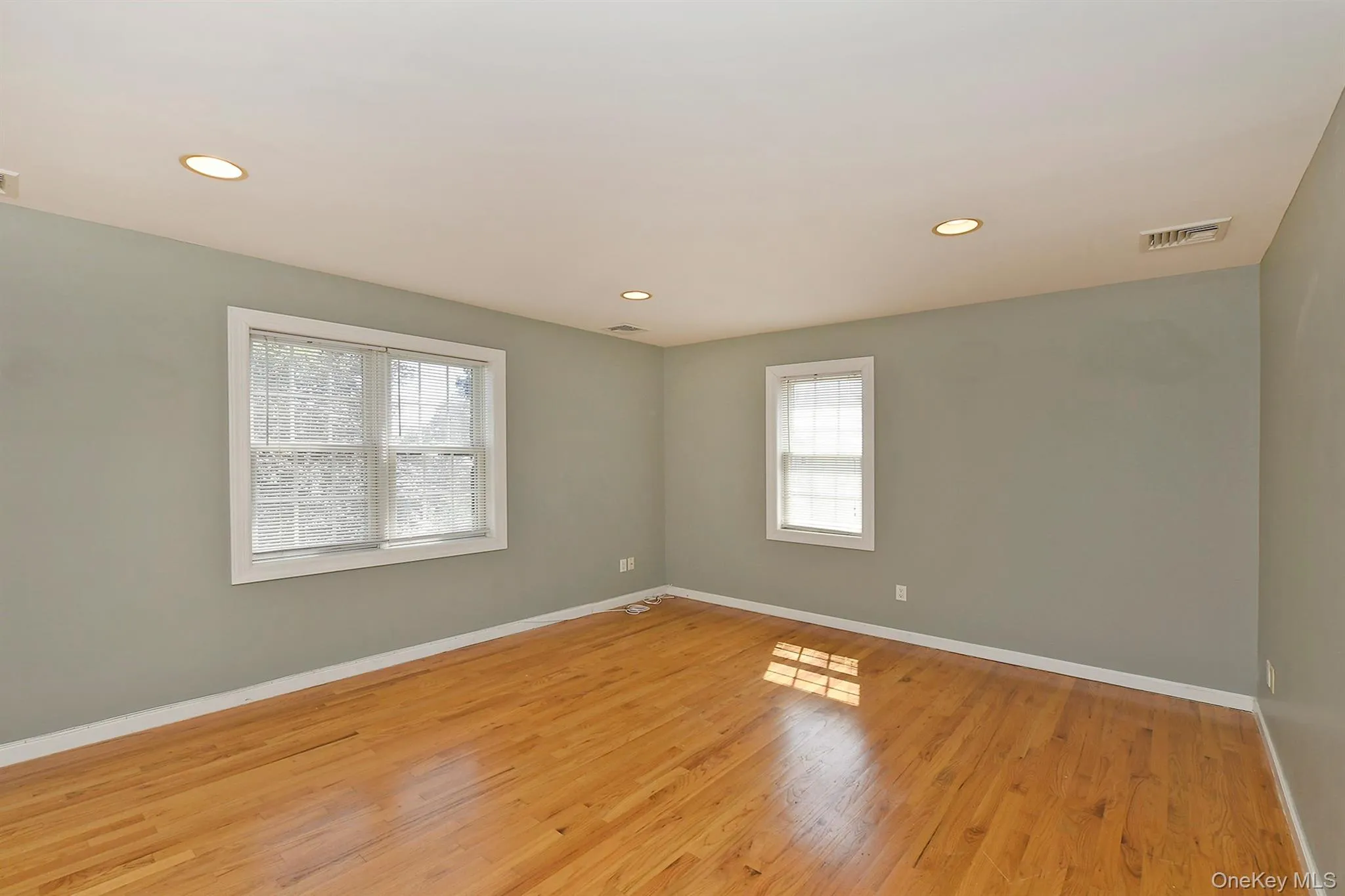 Unfurnished room with recessed lighting and light wood-style flooring Unfurnished room with recessed lighting and light wood-style flooring