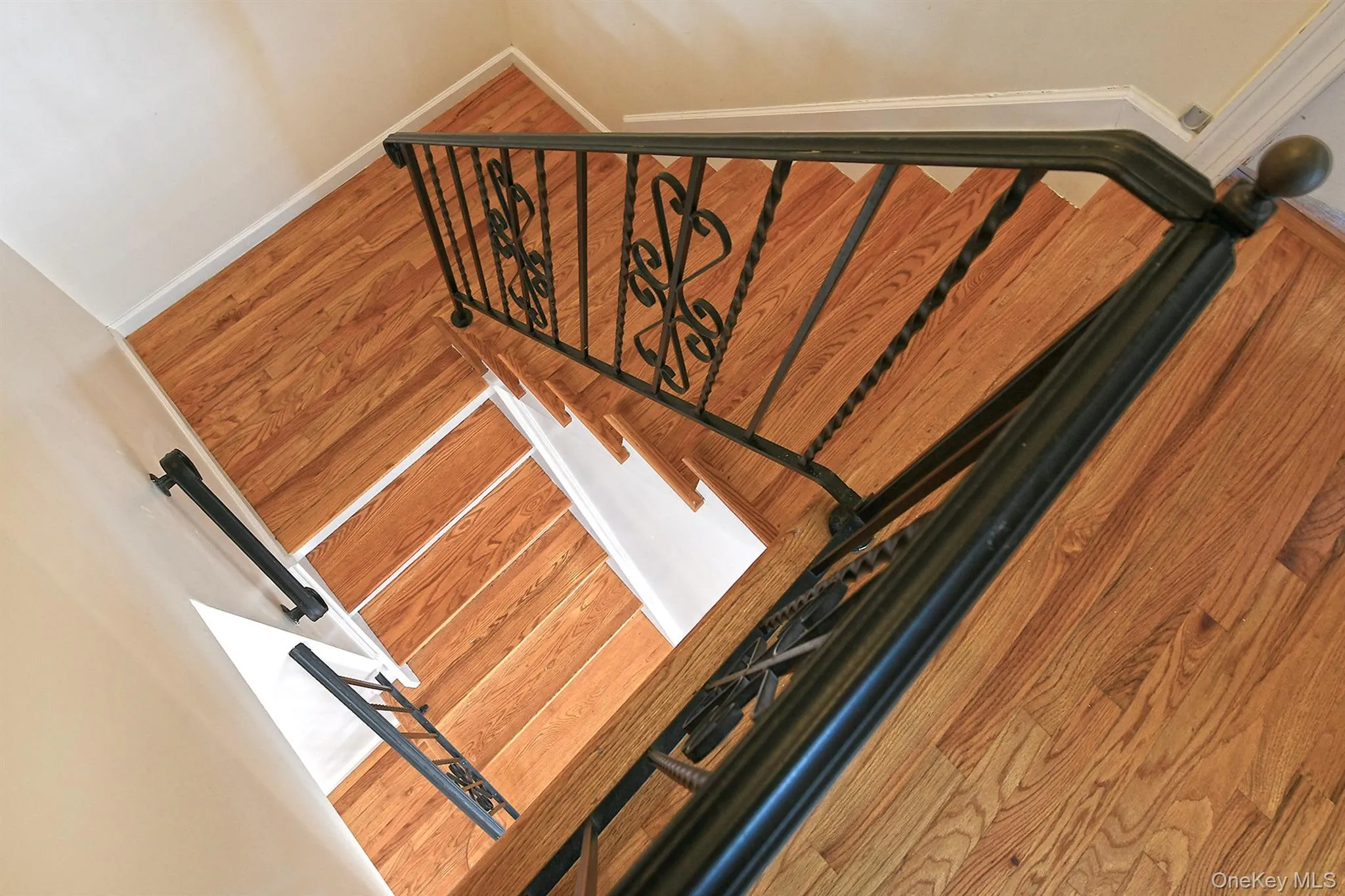 Stairs with wood finished floors and baseboards Stairs with wood finished floors and baseboards