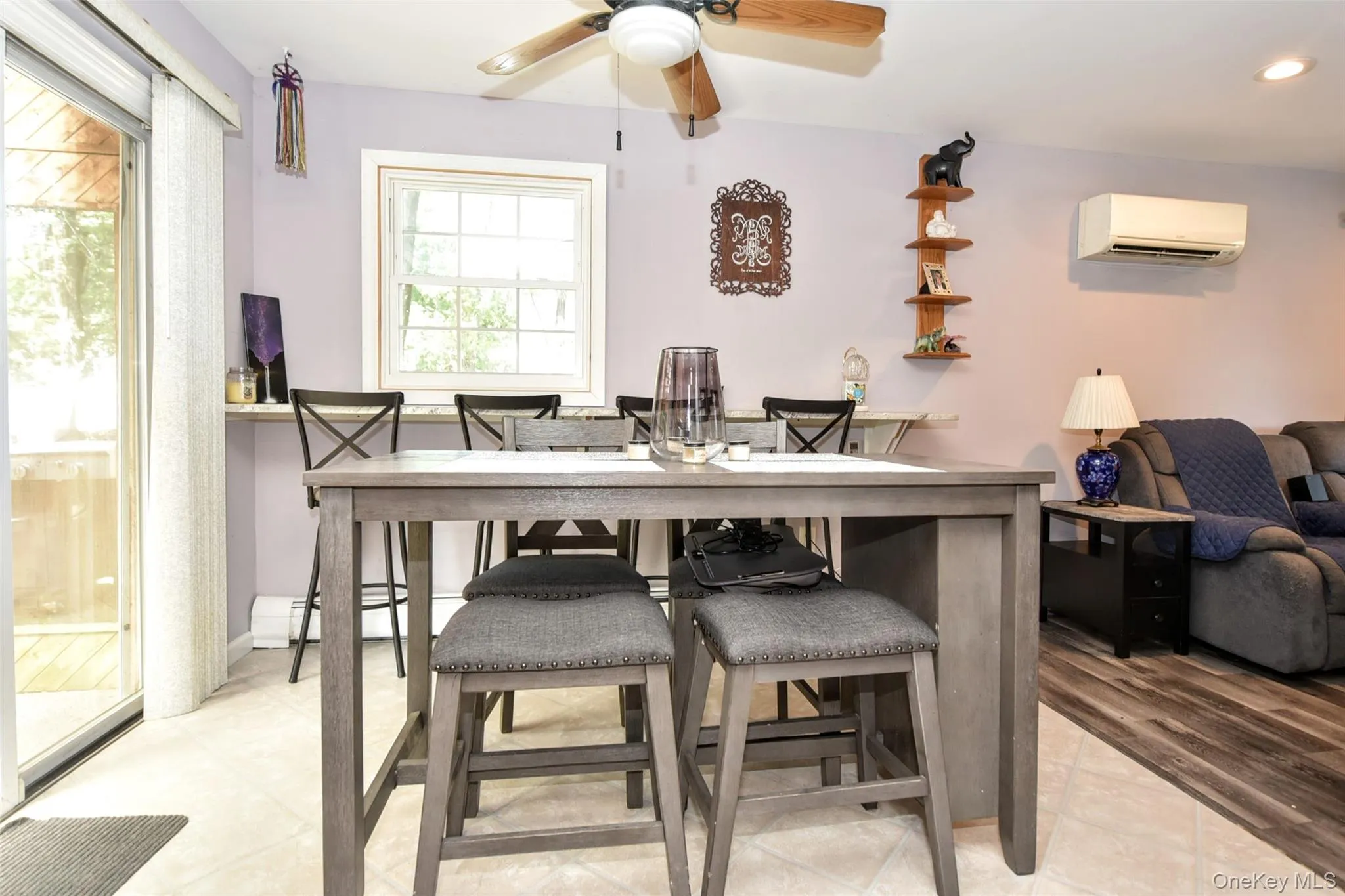 Dining area with a ceiling fan, an AC wall unit, and recessed lighting Dining area with a ceiling fan, an AC wall unit, and recessed lighting