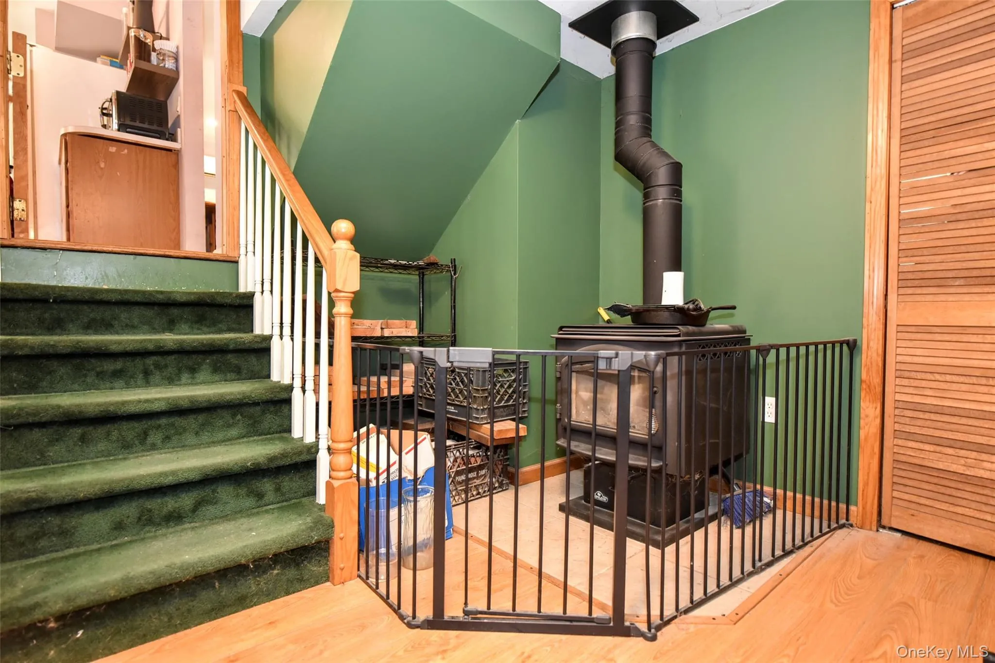 Stairs with a wood stove and wood finished floors Stairs with a wood stove and wood finished floors