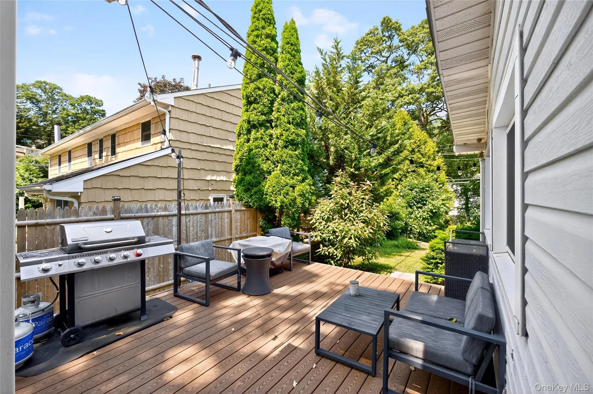 Beautiful Trex Deck featuring grilling area and view of large yard Beautiful Trex Deck featuring grilling area and view of large yard