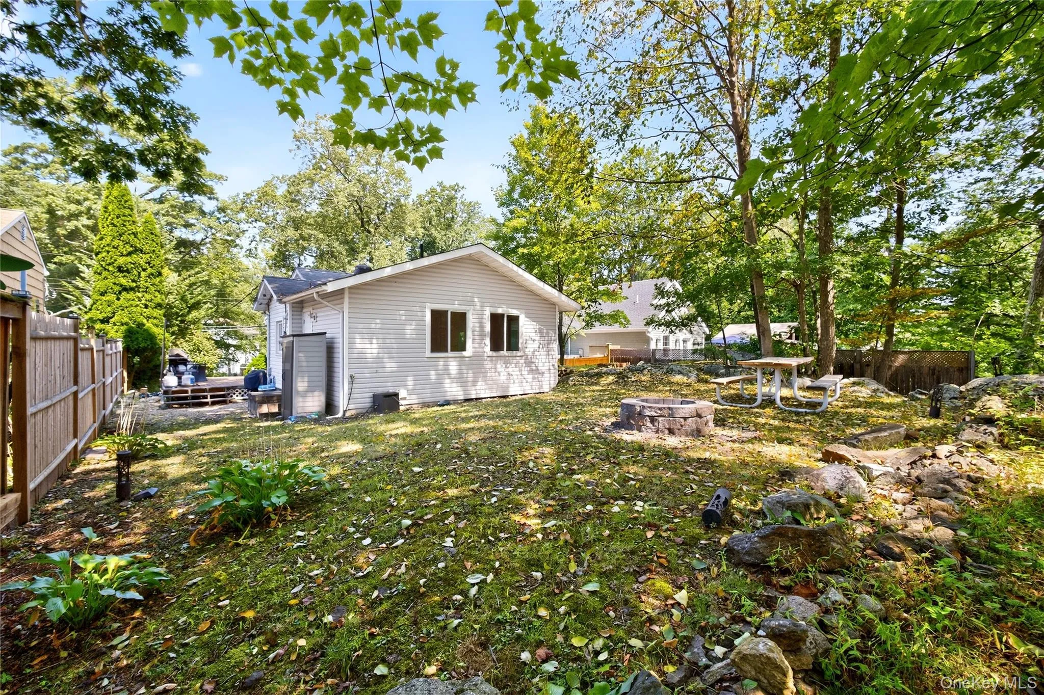 private backyard with a fire pit private backyard with a fire pit