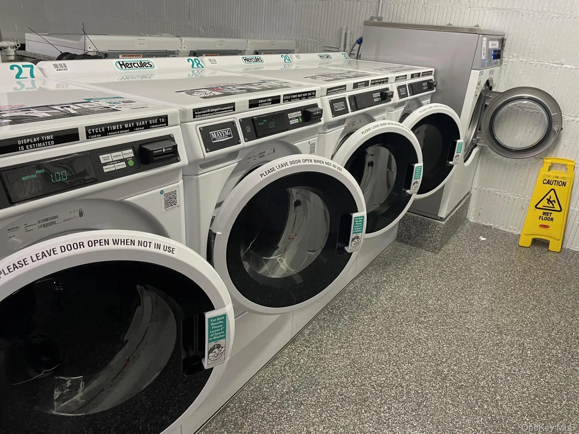 Shared laundry featuring washing machine and clothes dryer Shared laundry featuring washing machine and clothes dryer