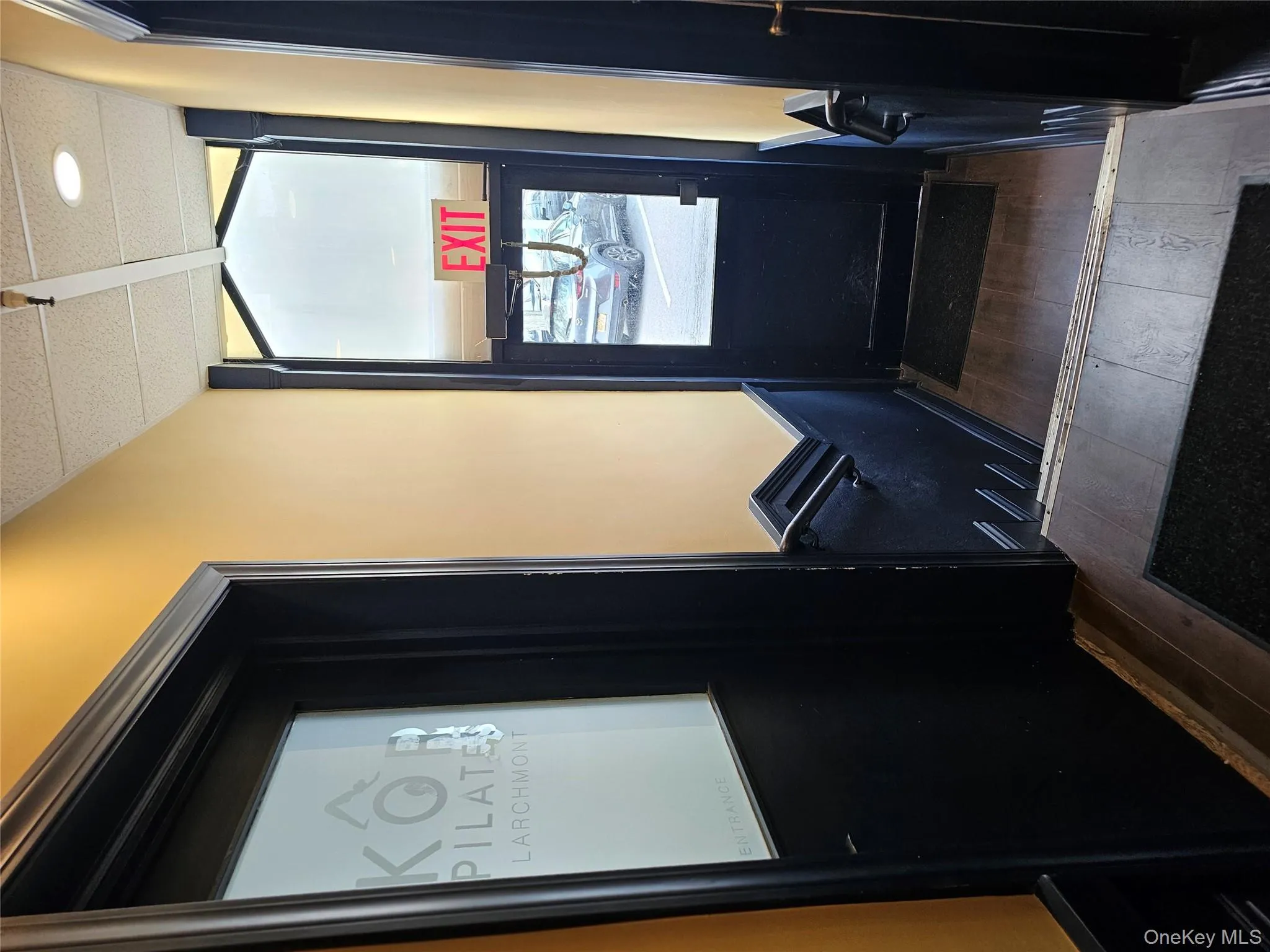 Doorway with hardwood / wood-style floors and elevator Doorway with hardwood / wood-style floors and elevator