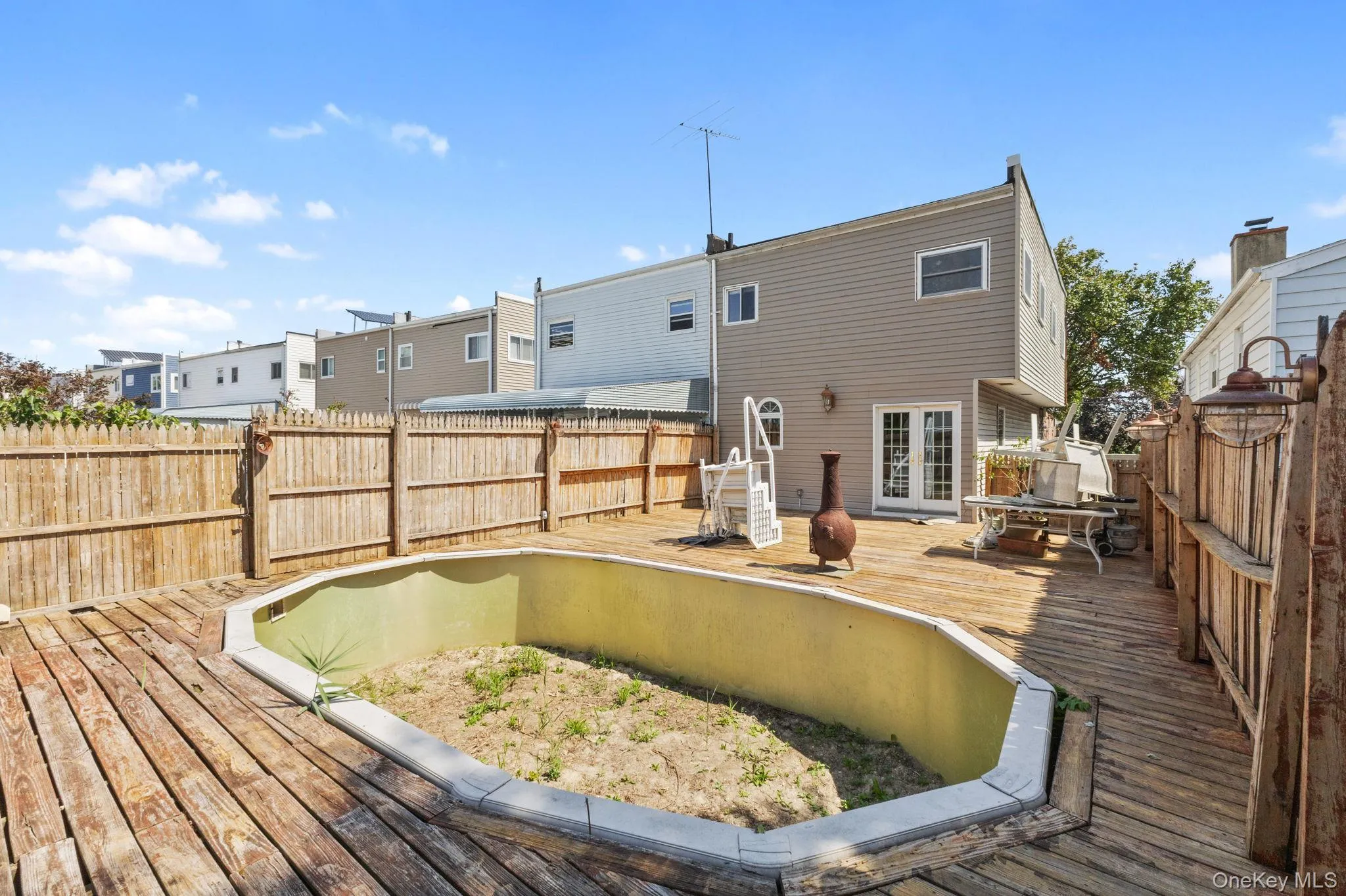 Deck featuring a fenced backyard and a residential view Deck featuring a fenced backyard and a residential view