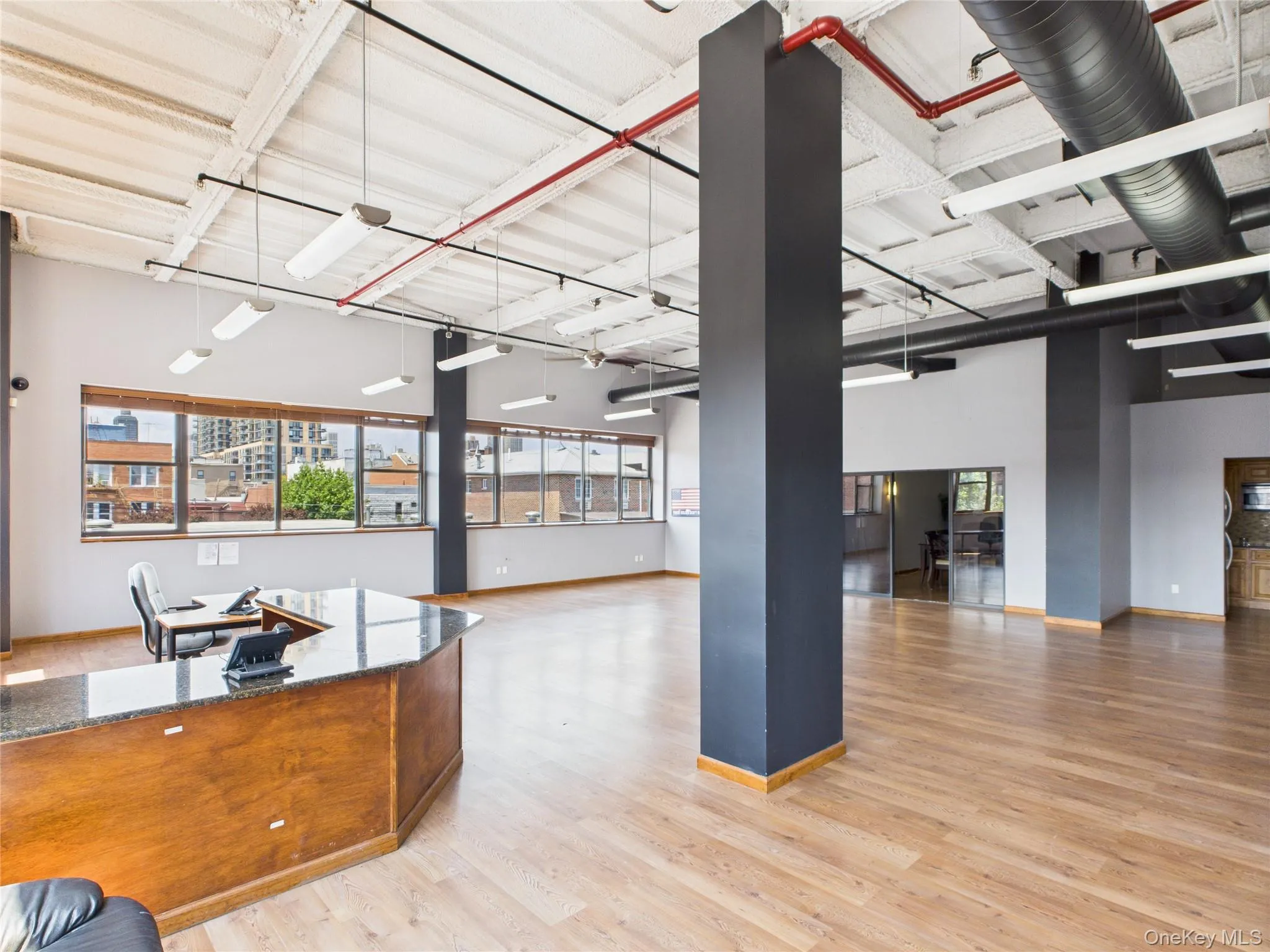Office area with light wood-style flooring Office area with light wood-style flooring