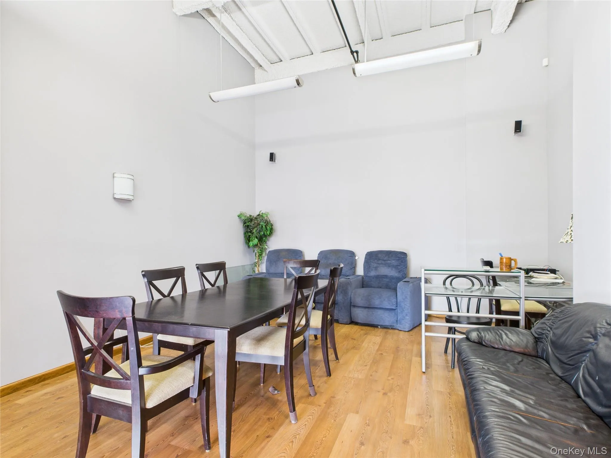 Dining room with light wood-type flooring Dining room with light wood-type flooring