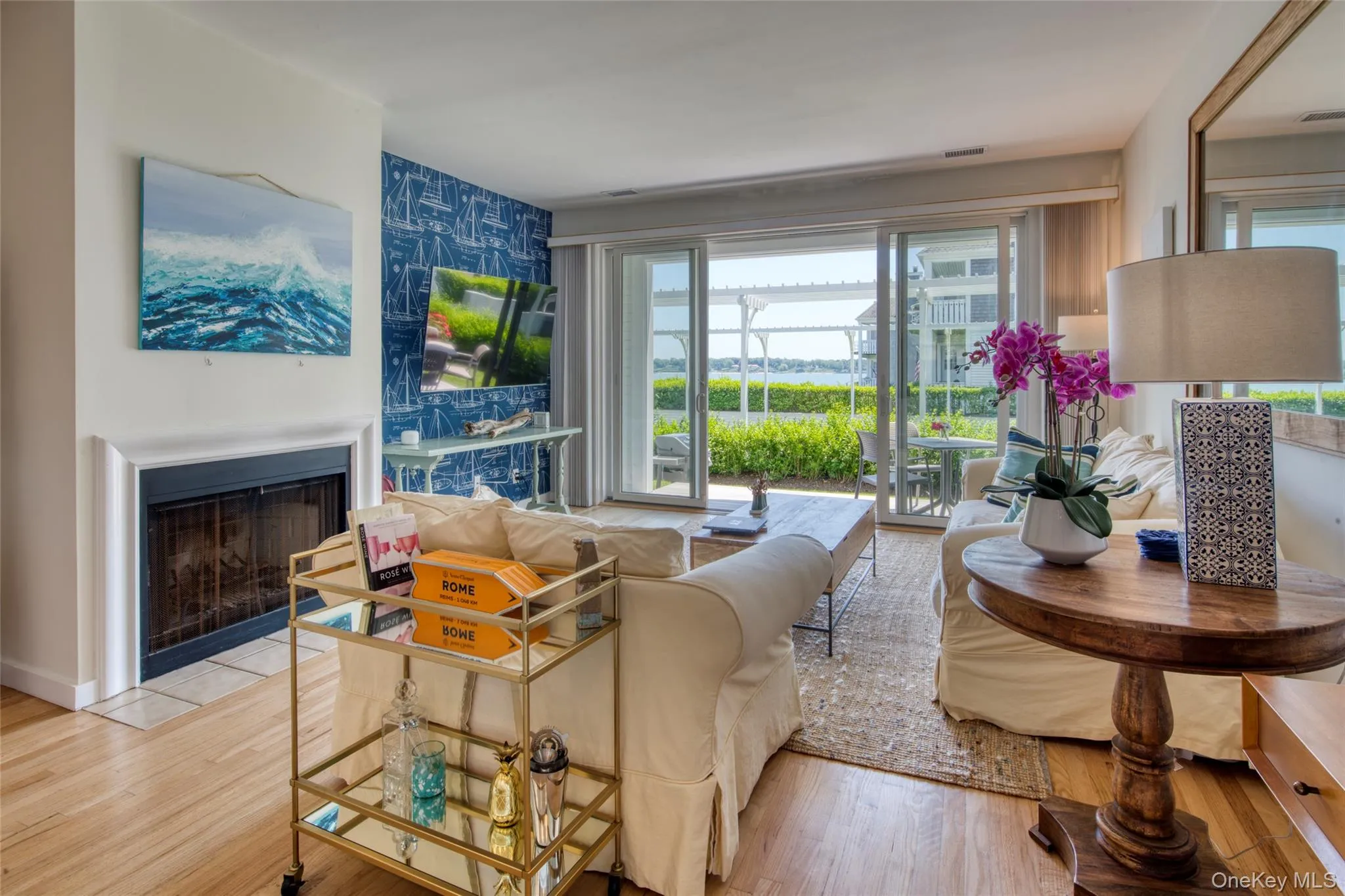 Living area featuring a fireplace with flush hearth Living area featuring a fireplace with flush hearth