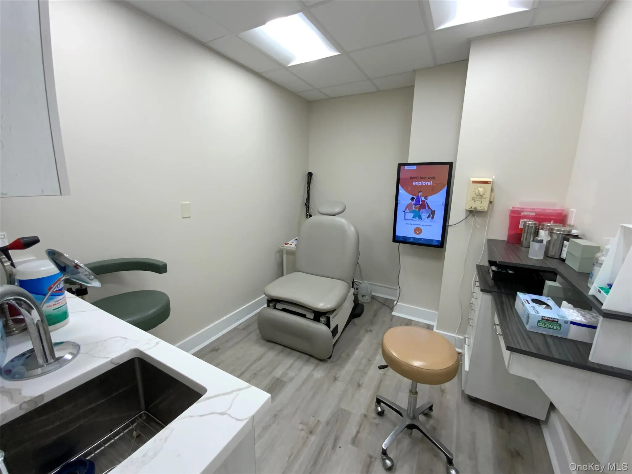 Office featuring a drop ceiling and light wood-style flooring Office featuring a drop ceiling and light wood-style flooring