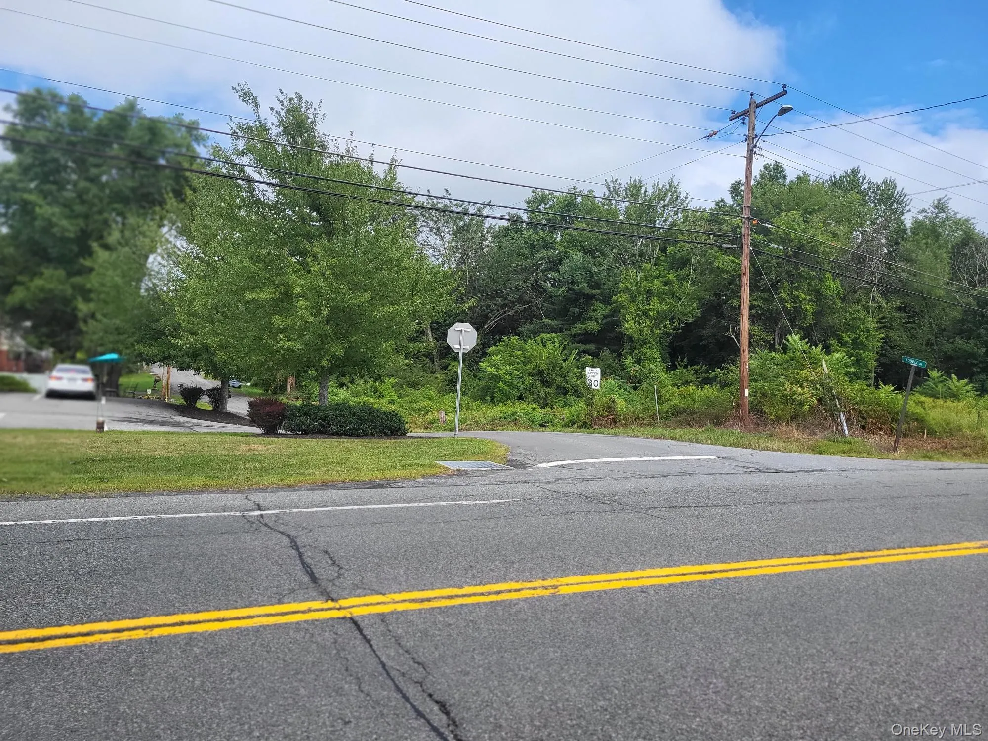 View of asphalt road with traffic signs View of asphalt road with traffic signs