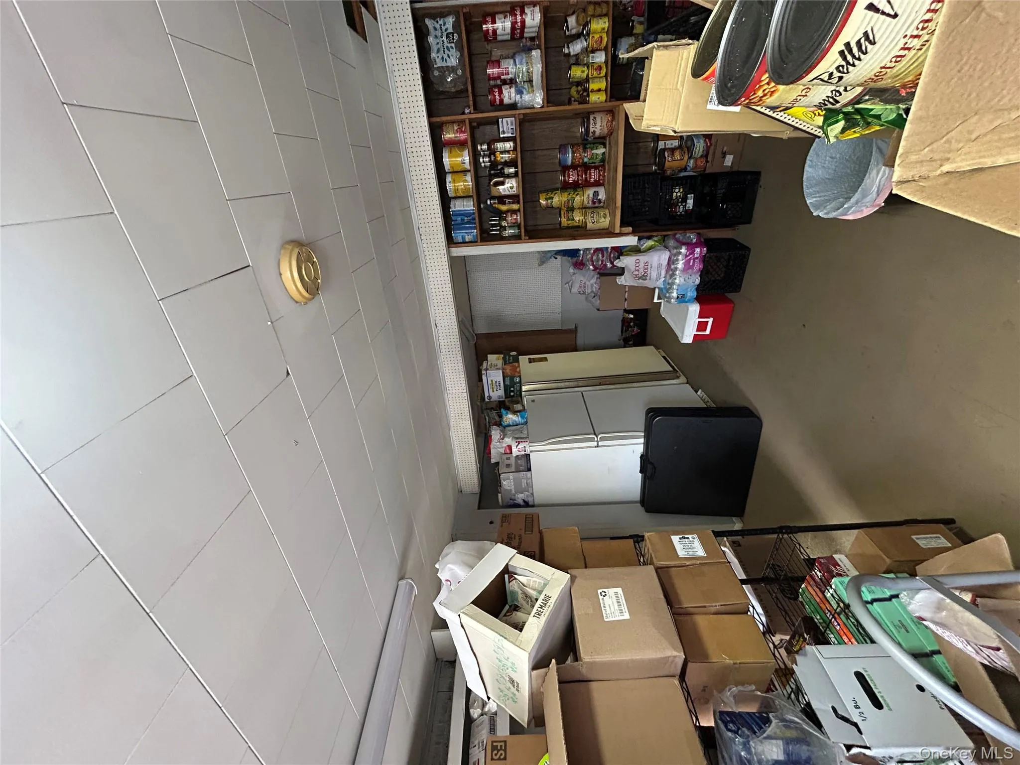 Finished below grade area featuring fridge Finished below grade area featuring fridge