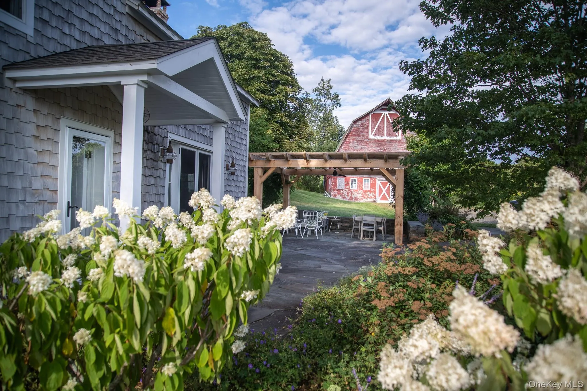 View from house to outdoor patio/pergola View from house to outdoor patio/pergola