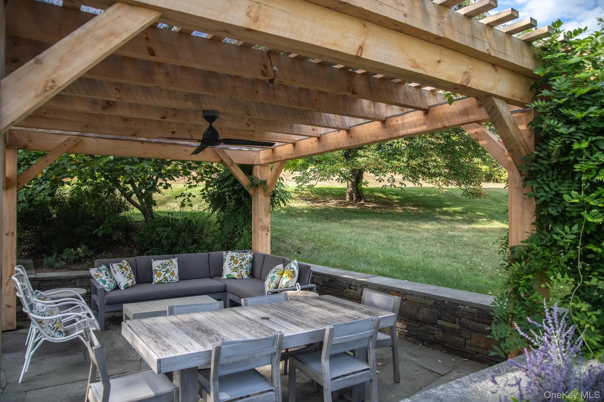 View of patio / terrace with an outdoor living space, a pergola, and ceiling fan View of patio / terrace with an outdoor living space, a pergola, and ceiling fan