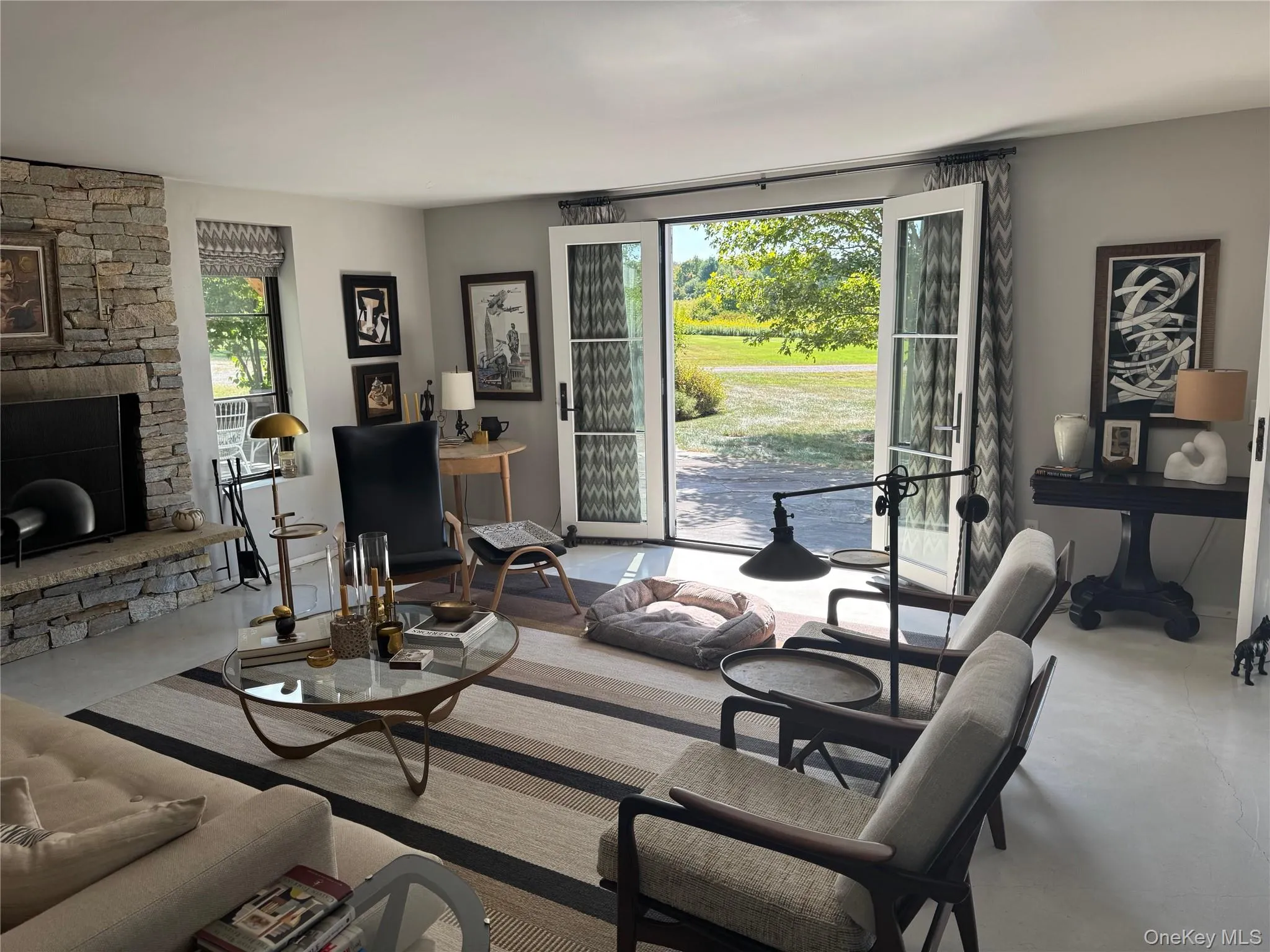 Living area with a stone fireplace Living area with a stone fireplace