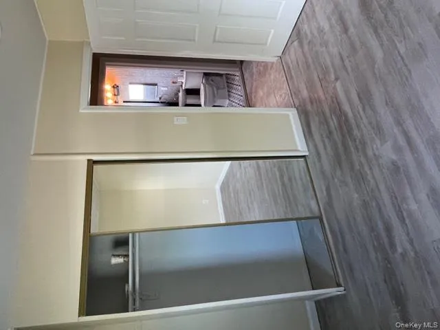 Unfurnished bedroom with dark wood-type flooring and a closet Unfurnished bedroom with dark wood-type flooring and a closet