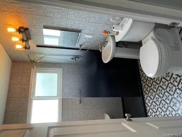 Bathroom with toilet and tiled shower Bathroom with toilet and tiled shower