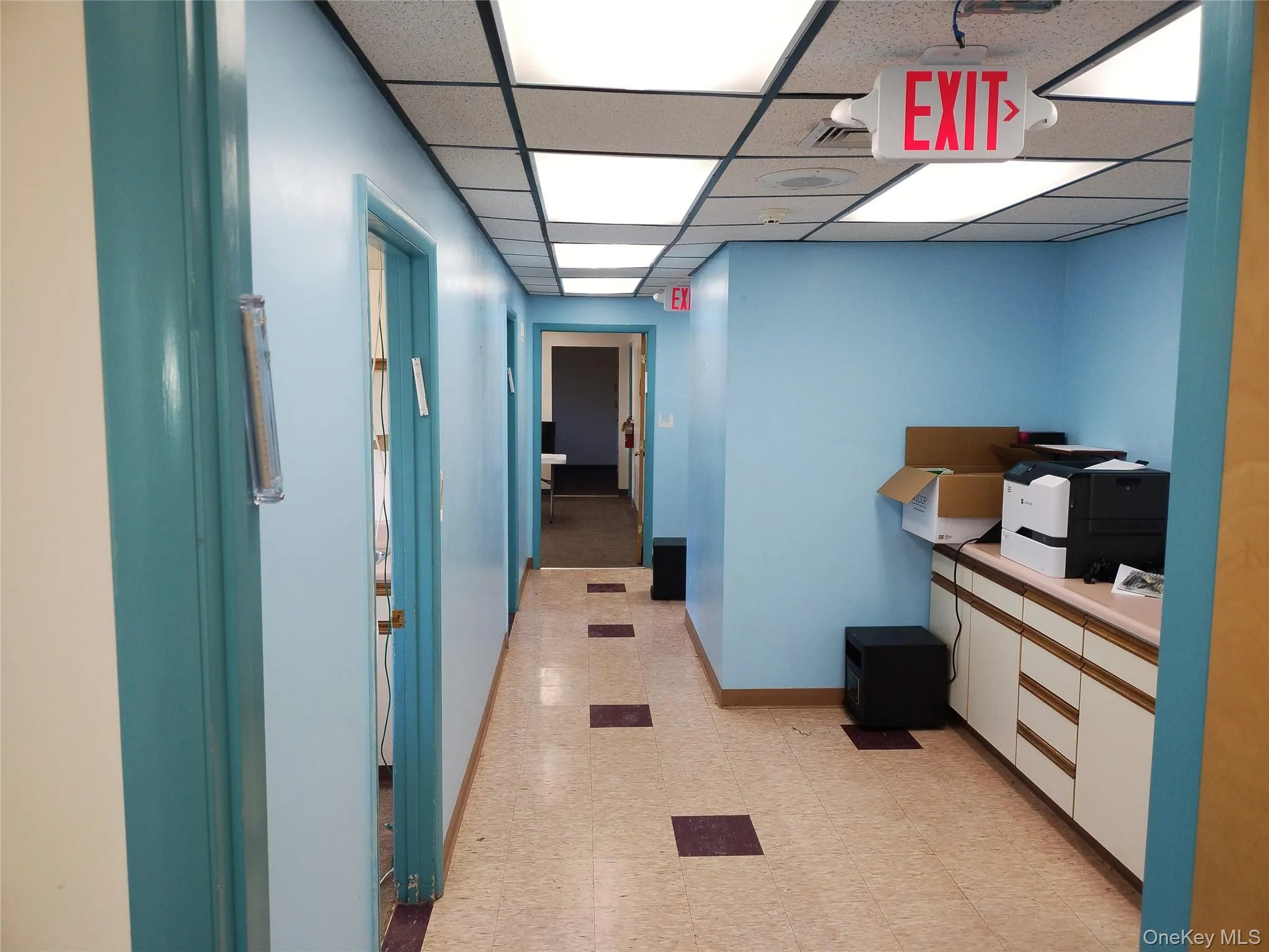 Hall featuring a paneled ceiling Hall featuring a paneled ceiling