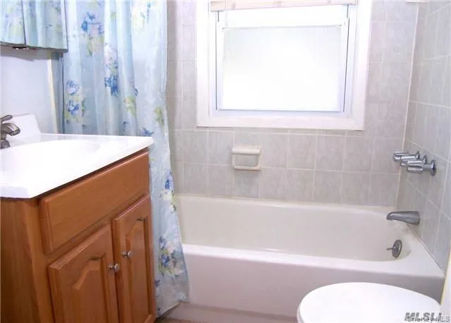 Full bath featuring shower / bath combo and vanity Full bath featuring shower / bath combo and vanity