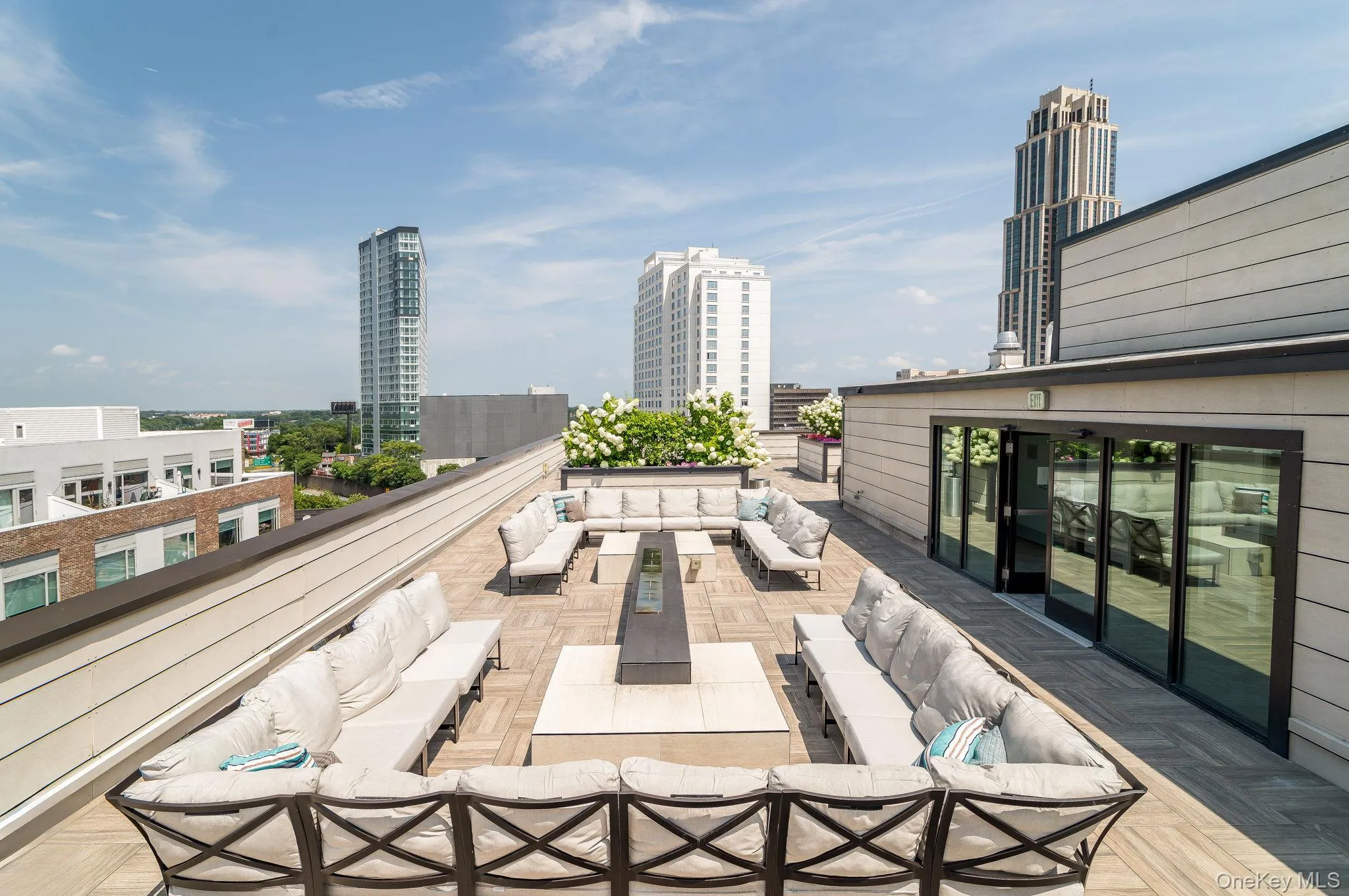 View of patio / terrace featuring outdoor lounge area and a city view View of patio / terrace featuring outdoor lounge area and a city view