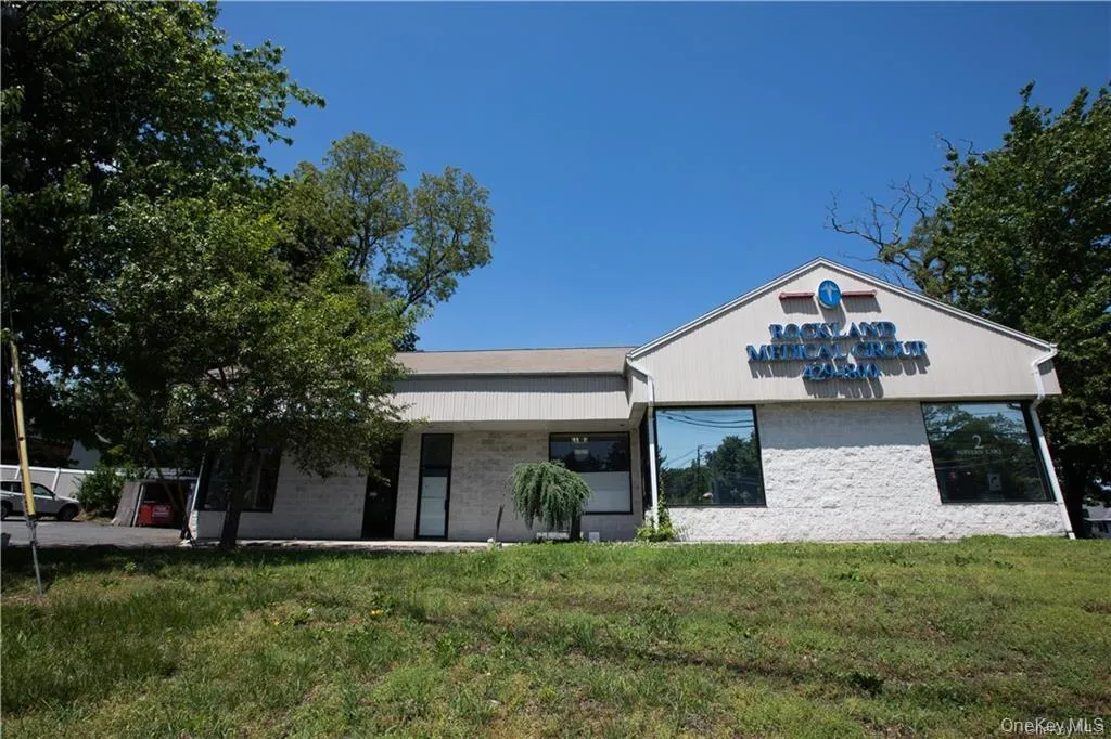 View of front of home with a front lawn, brick siding, and covered porch View of front of home with a front lawn, brick siding, and covered porch
