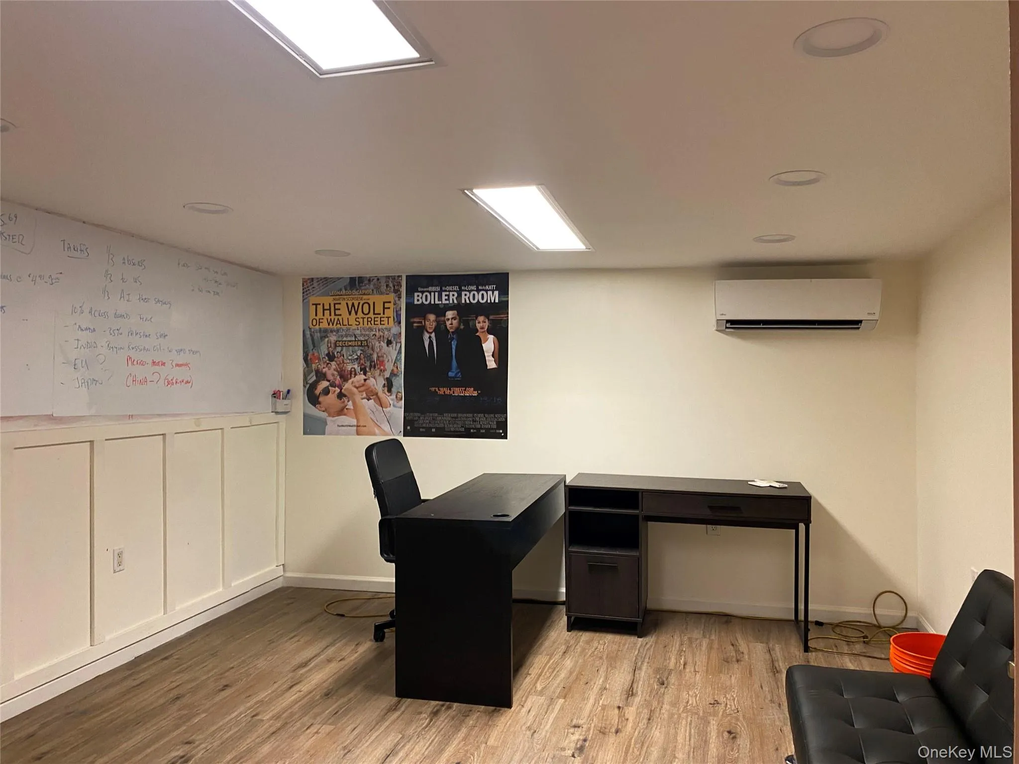Office area with light wood-style flooring, a wall mounted air conditioner, and recessed lighting Office area with light wood-style flooring, a wall mounted air conditioner, and recessed lighting