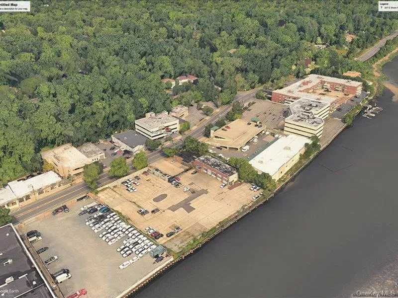 Aerial overview of property\'s location with a nearby body of water Aerial overview of property\'s location with a nearby body of water