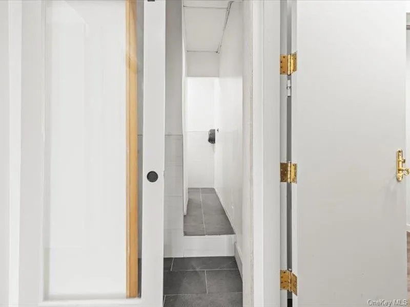 Hallway with tile patterned floors Hallway with tile patterned floors