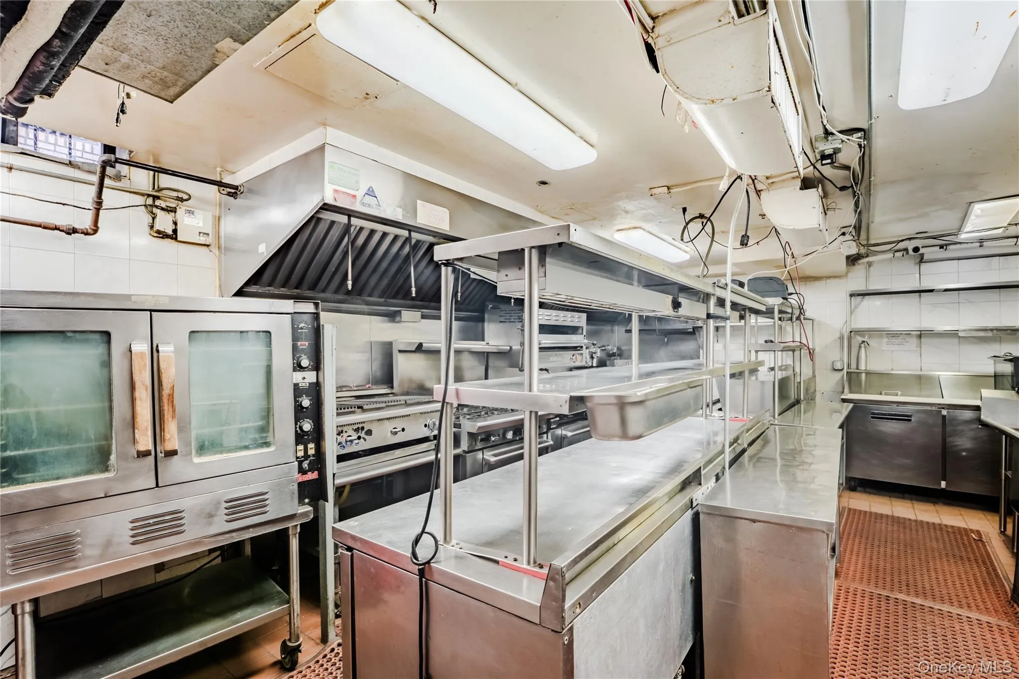 Kitchen featuring stainless steel countertops Kitchen featuring stainless steel countertops