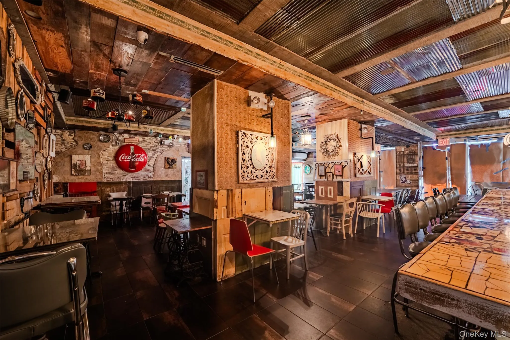 Below grade area with wood ceiling, wooden walls, and a wainscoted wall Below grade area with wood ceiling, wooden walls, and a wainscoted wall