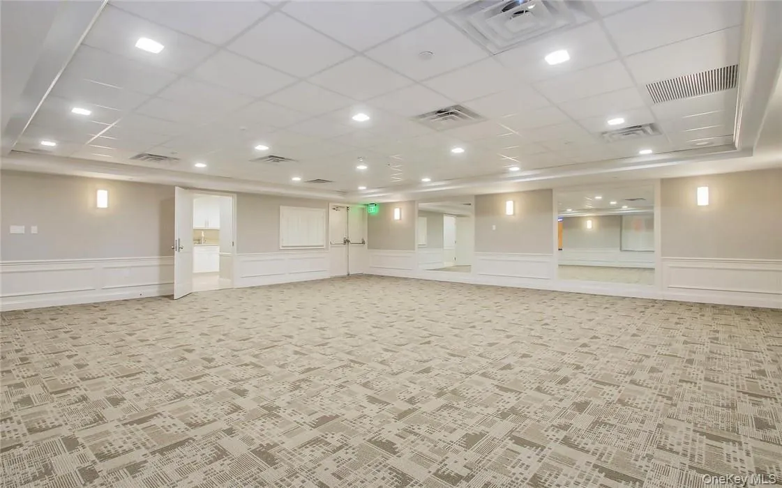 Tower Club Community Room with light colored carpet and a paneled ceiling. Available for larger parties. Tower Club Community Room with light colored carpet and a paneled ceiling. Available for larger parties.