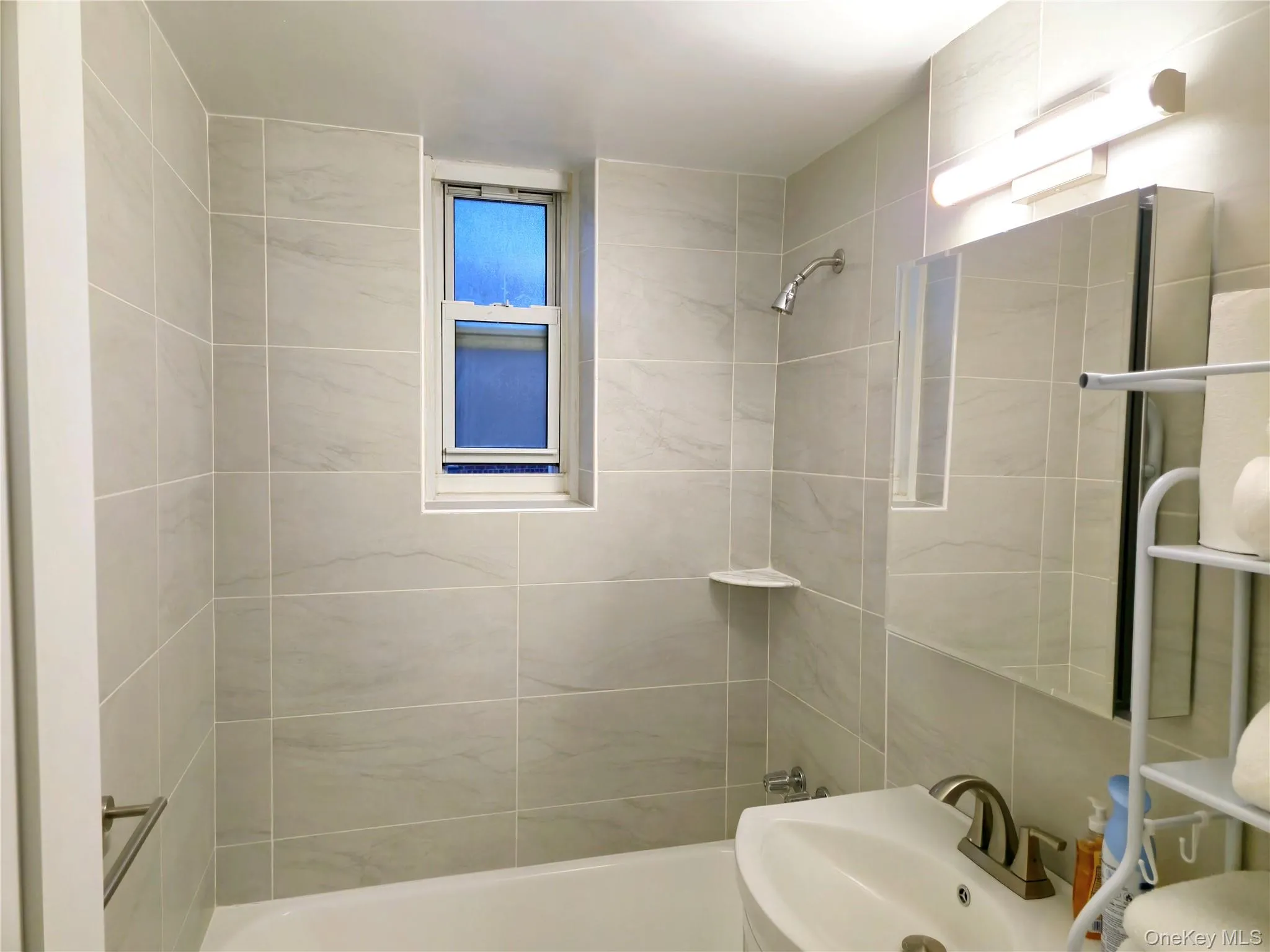 Full bath with a sink and shower / washtub combination Full bath with a sink and shower / washtub combination