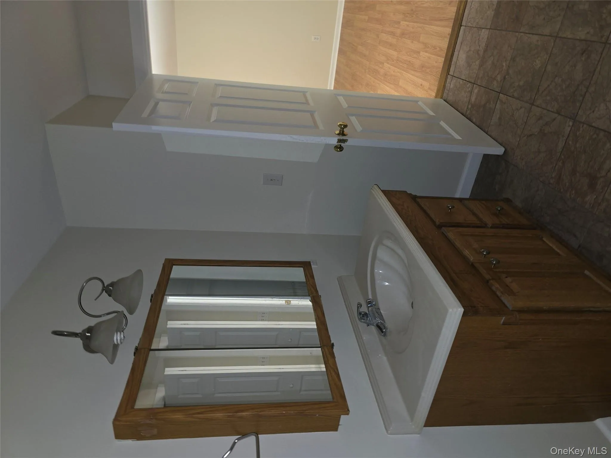 Bathroom with vanity and baseboards Bathroom with vanity and baseboards