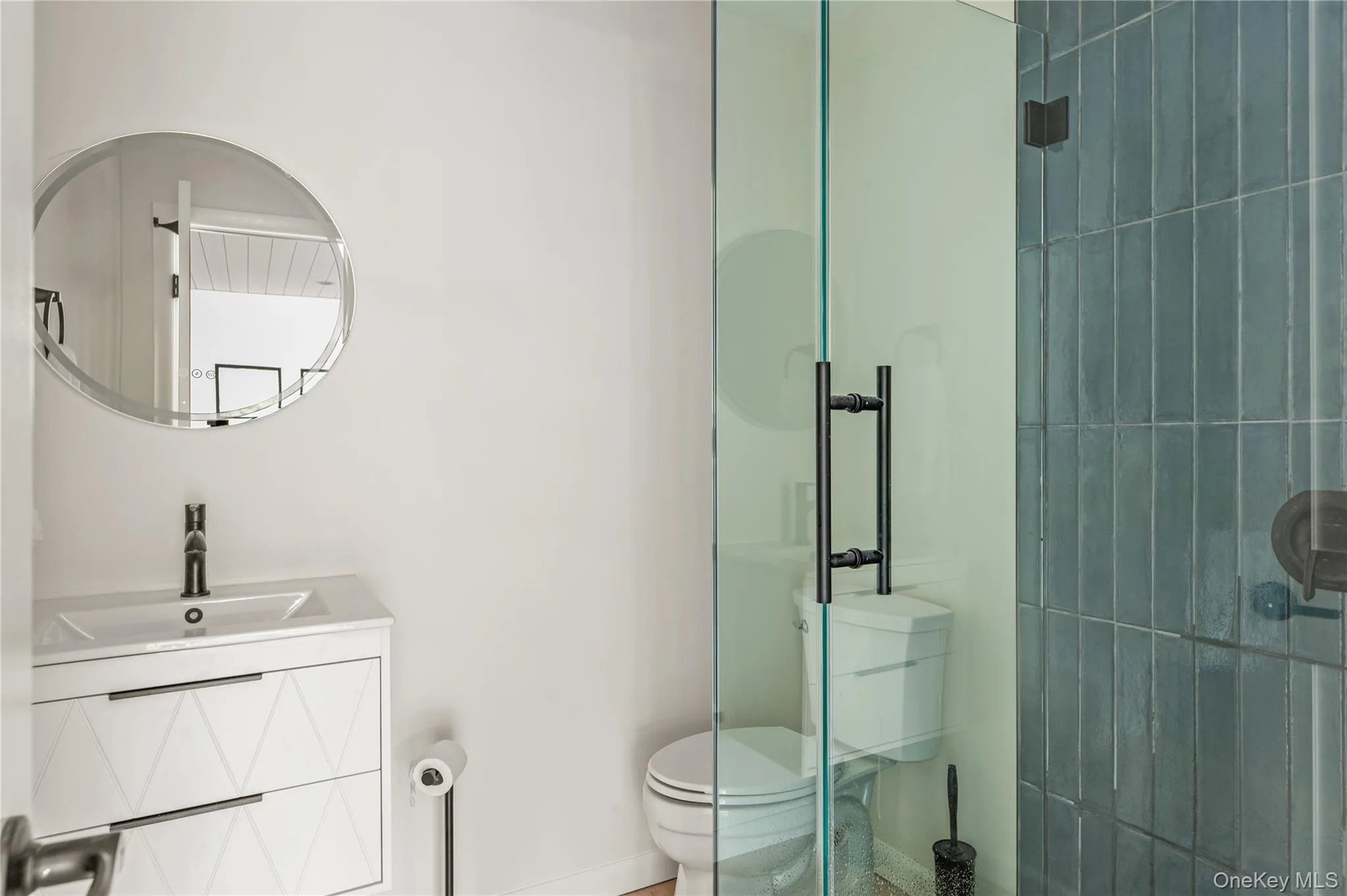 Full bathroom with a stall shower and vanity Full bathroom with a stall shower and vanity