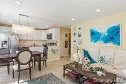 Living room featuring a chandelier and recessed lighting Living room featuring a chandelier and recessed lighting