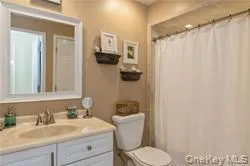 Full bathroom featuring vanity and toilet Full bathroom featuring vanity and toilet