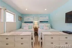 Bedroom featuring light wood finished floors and recessed lighting Bedroom featuring light wood finished floors and recessed lighting