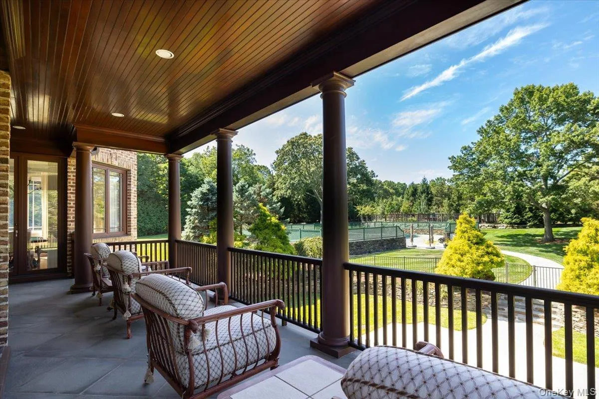 Deck featuring view of scattered trees Deck featuring view of scattered trees