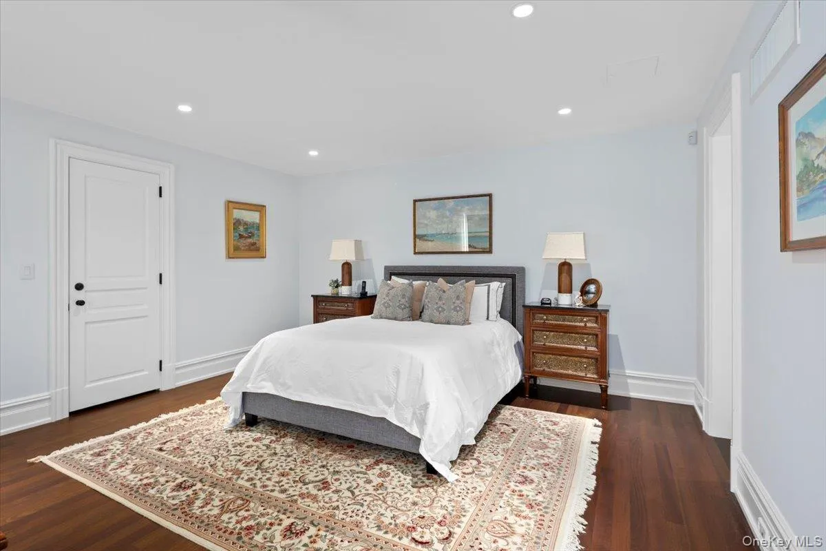 Bedroom with recessed lighting and dark wood-type flooring Bedroom with recessed lighting and dark wood-type flooring